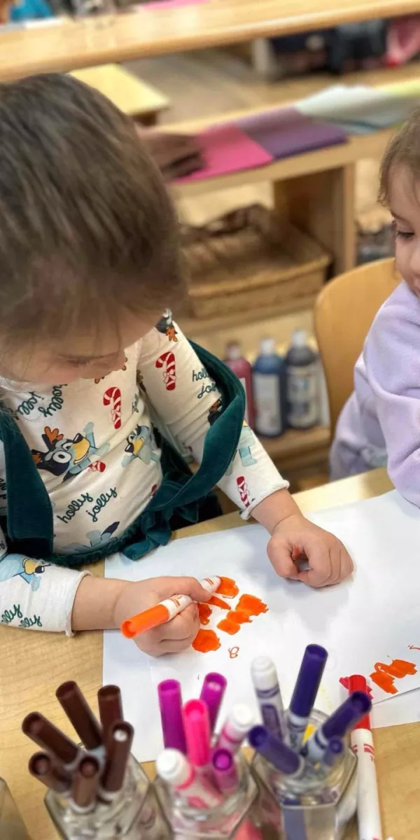 Children engaging in painting activities in our prospect daycare