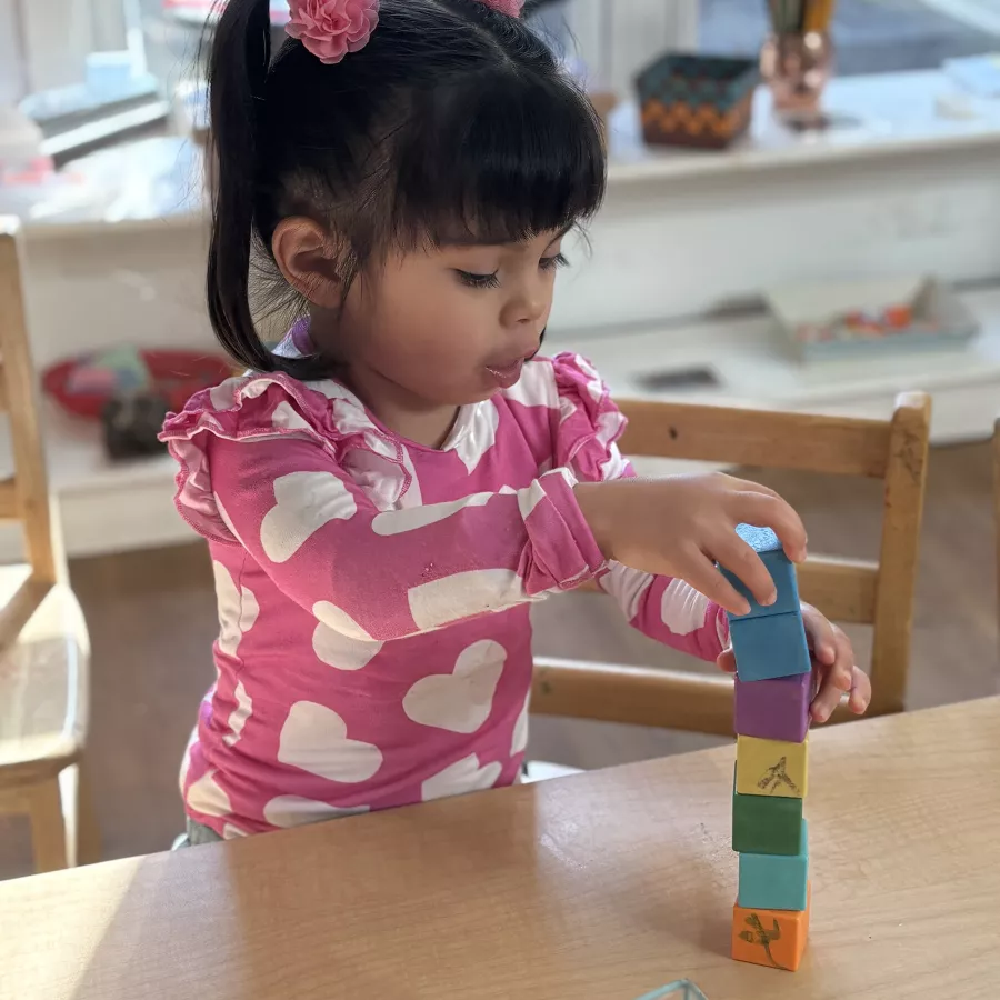 child engaged in sensory play in our daycare in Huntsville, AL