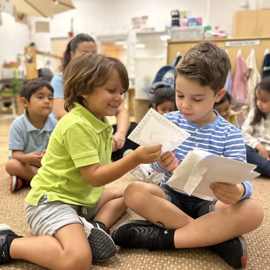 classroom engaged in reviewing letters at our Doral daycare