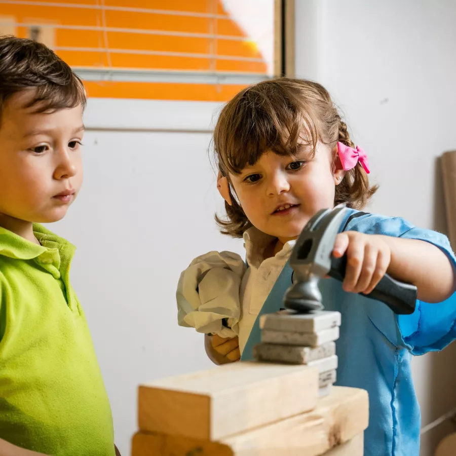 two year olds playing with block at our childcare center
