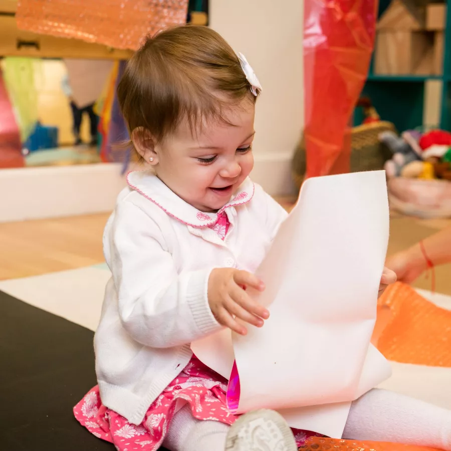 a baby playing in our daycare for infants