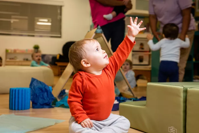 a baby playing in our daycare for infants