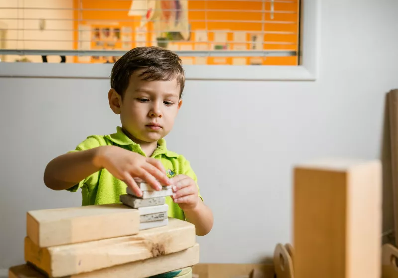 Preschool boy playing blocks