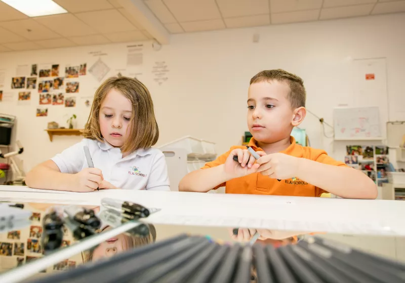 Preschool boy girl art writing