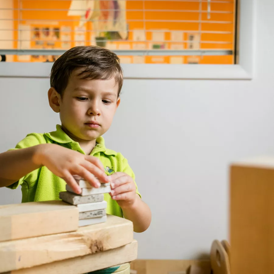 Preschool boy playing blocks