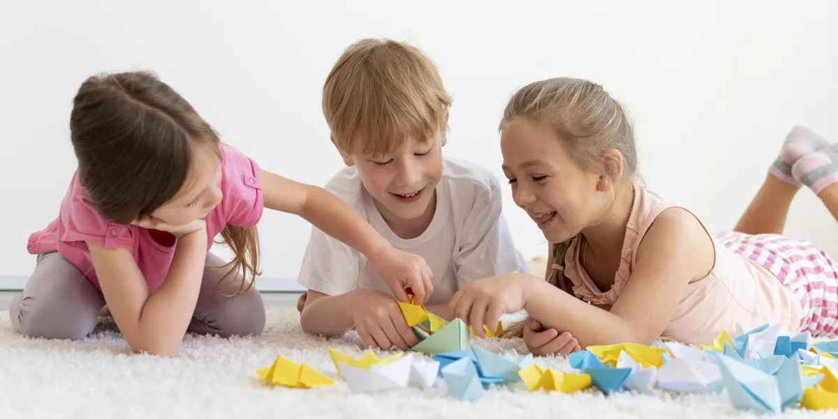 Medium shot kids with paper boats