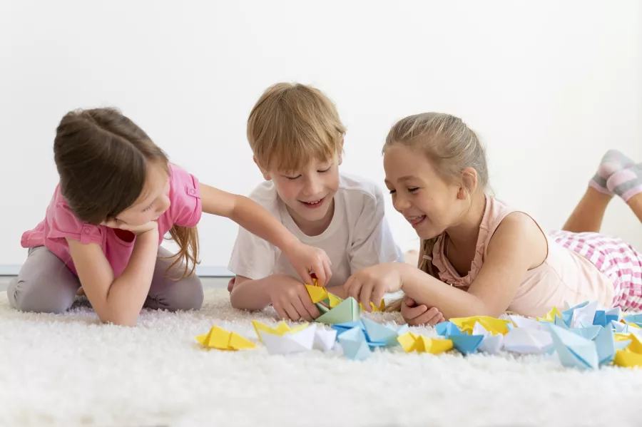 Medium shot kids with paper boats