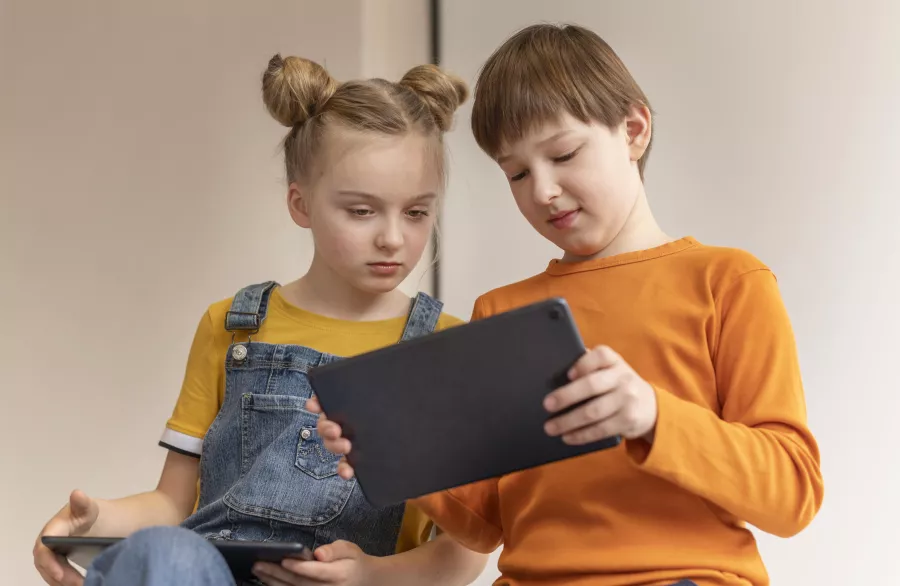 Low angle kids learning with devices