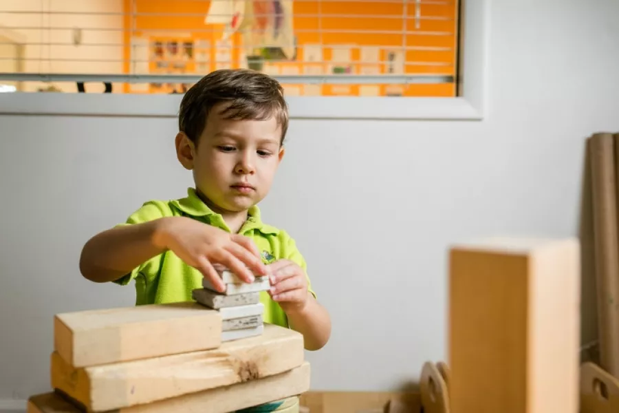 Blocks in classroom preschool student