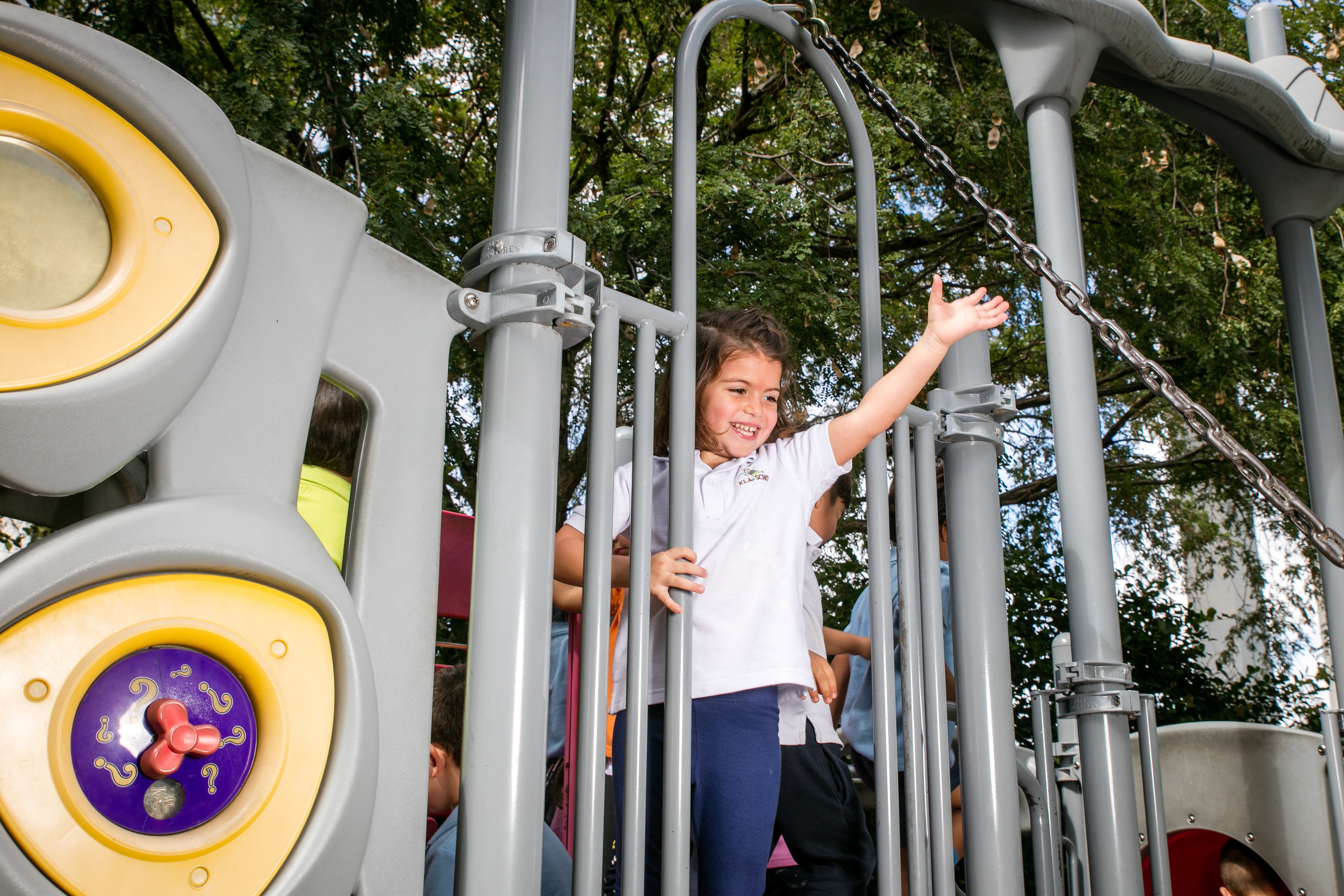 Preschool girl playing outside playground