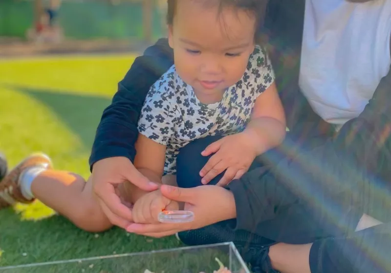 a parent with her daughter in our daycare