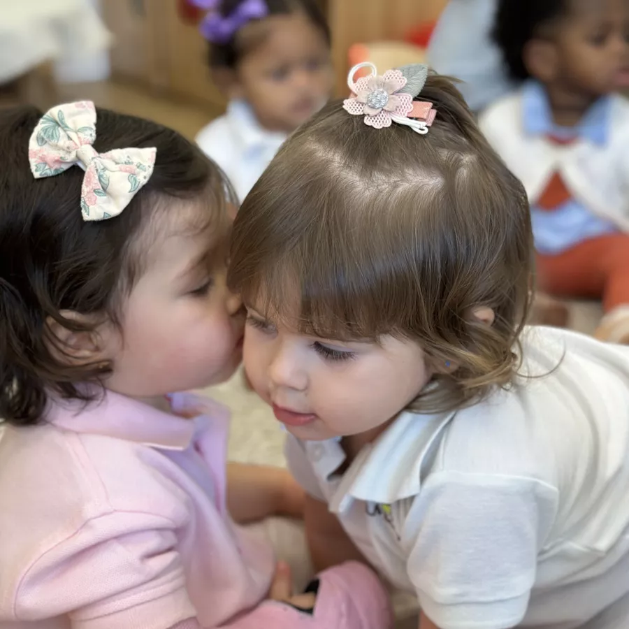 Two girls engaging in nido class