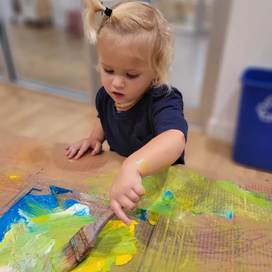 a student coloring in our daycare
