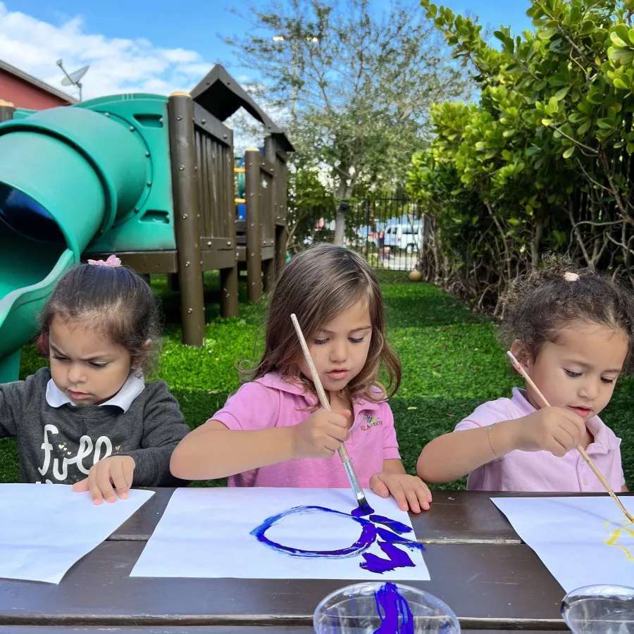 Girls drawing outside
