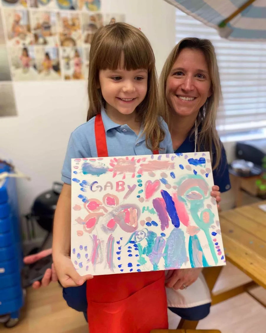 Girl displaying her art